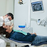 dentist examining a patient’s mouth 