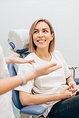 Dentist explains something to patient