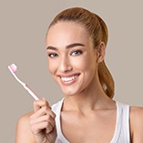 Woman holding toothbrush