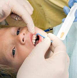 little girl receiving dental treatment