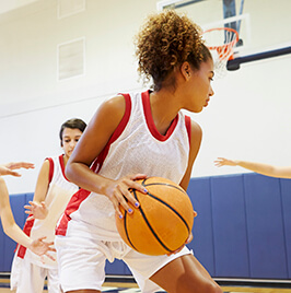 girl playing basketball