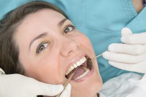 Woman receiving dental checkup