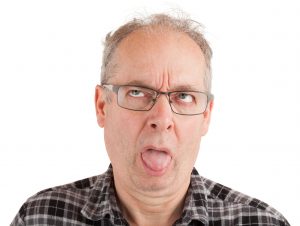 man frowning bad taste in mouth