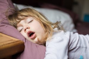 A young child sleeping.