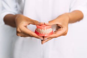 mature man smiling with dentures 