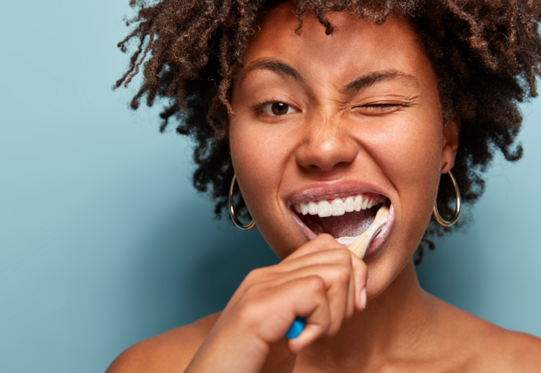 Woman brushing teeth